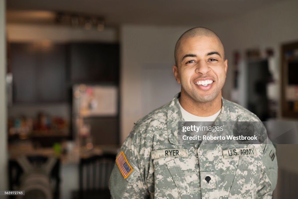 Mixed race man smiling in living room