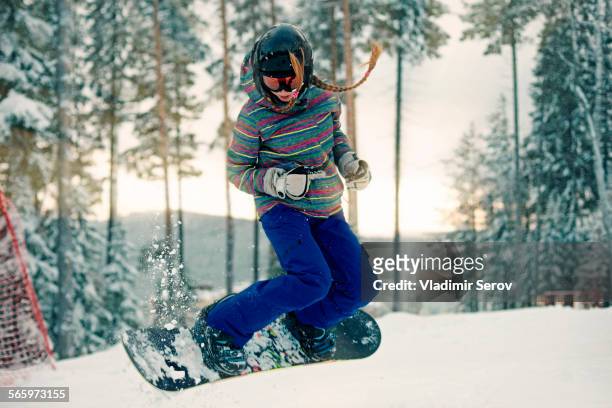 caucasian girl riding snowboard in snow - teen boots russian stock pictures, royalty-free photos & images