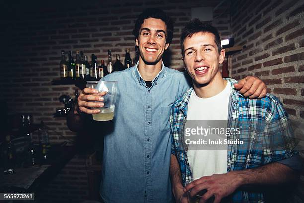 smiling men drinking in nightclub - man party night bar posing stock pictures, royalty-free photos & images