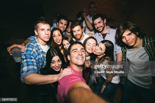 smiling friends taking selfie in nightclub - bar tender photos et images de collection
