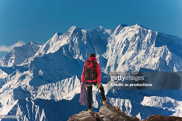 caucasian hiker admiring scenic view from mountaintop, monte rosa, alps, italy - monte rosa fotografías e imágenes de stock