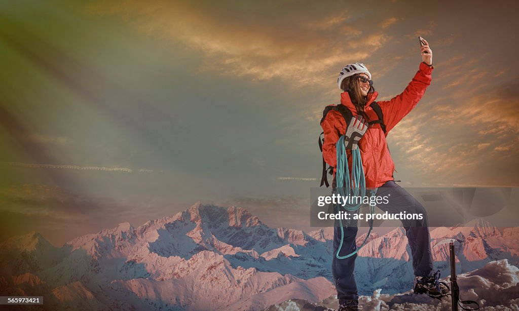 Caucasian hiker taking selfie on mountaintop, Monte Rosa, Alps, Italy