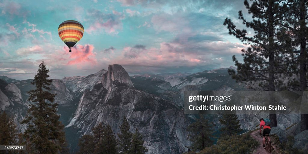 Hot air balloon floating over half dome in Yosemite, United States