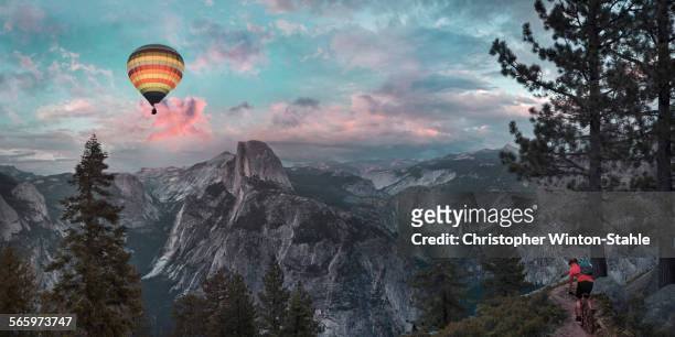 hot air balloon floating over half dome in yosemite, united states - hot air balloon ride stock pictures, royalty-free photos & images