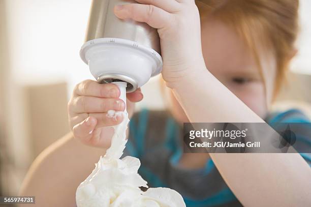 caucasian girl spraying whipped cream - whipped cream stock pictures, royalty-free photos & images