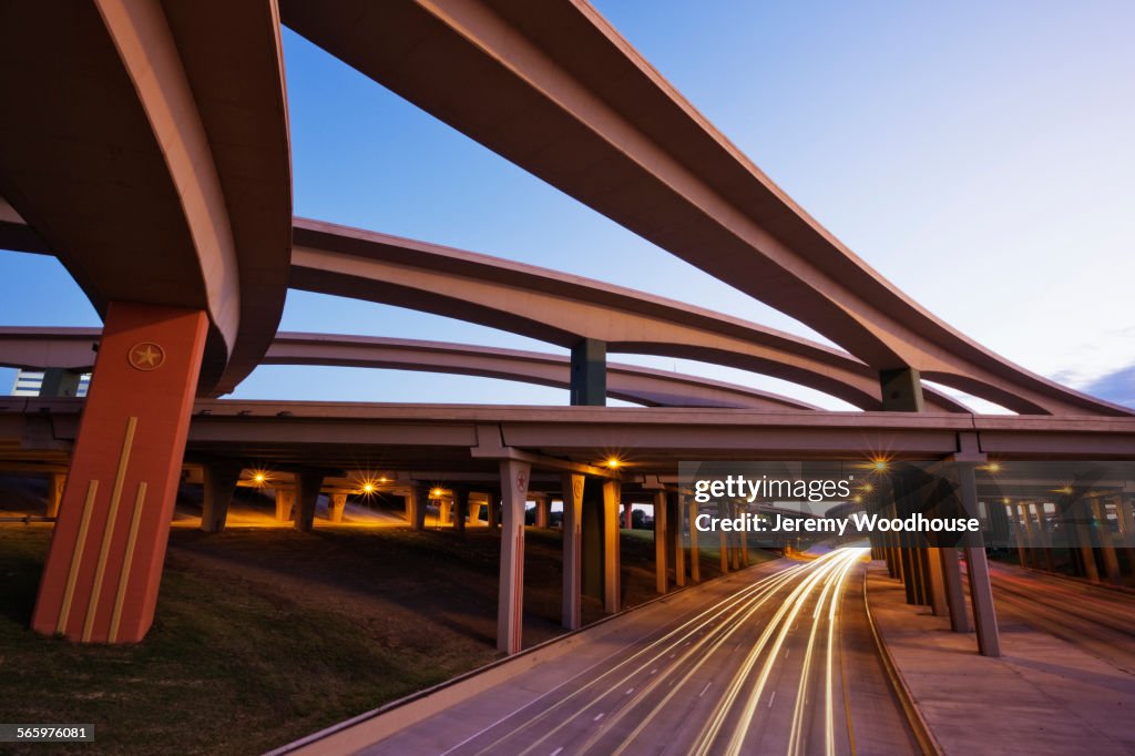 Blurred motion view of traffic driving on highway underpass