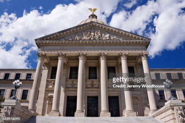 low angle view of facade of mississippi state capitol, jackson, mississippi, united states - mississippi v mississippi state stock pictures, royalty-free photos & images