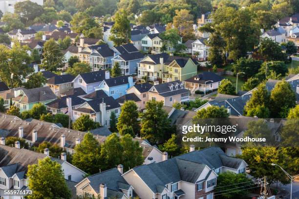 aerial view of house roofs in suburban neighborhood - atlanta stockfoto's en -beelden