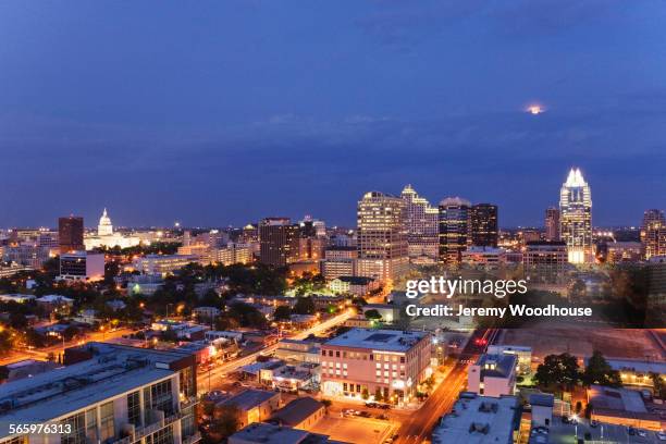 aerial view of austin cityscape illuminated at night, texas, united states - austin texas aerial stock pictures, royalty-free photos & images