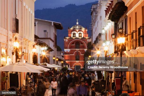 blurred motion view of tourists walking on san cristobal de las casas street, chiapas, mexico - san cristobal stock pictures, royalty-free photos & images