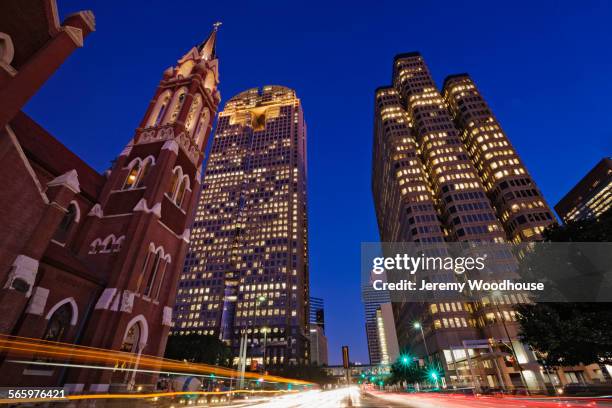 time lapse view of illuminated highrise buildings and traffic in dallas cityscape, texas, united states - texas church stock pictures, royalty-free photos & images