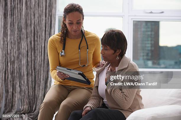 doctor and patient using digital tablet in office - medical chart stock pictures, royalty-free photos & images