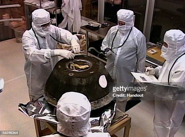 In this handout photo provided by NASA, NASA's Stardust sample return capsule is seen in a temporary cleanroom after successfully landing at the U.S....
