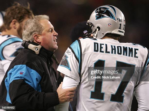 Head coach John Fox of the Carolina Panthers talks with quaterback Jake Delhomme against the Chicago Bears at Soldier Field on January 15, 2006 in...