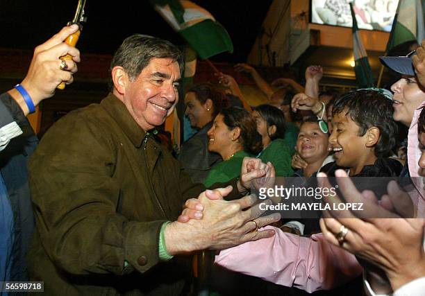 Former Costa Rican president and presidential candidate, Oscar Arias , of Partido Liberacion Nacional , shakes hands with supporters January 15...