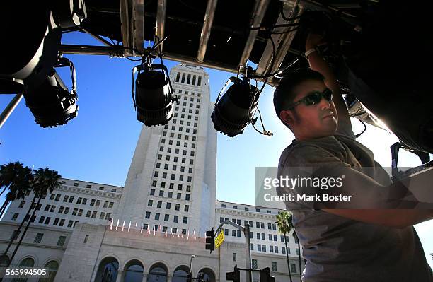 Lighting technicians with Kinetic Lighting set the stage for the big New Year's eve party called N.Y.E. L.A. In the Grand Park in Downtown Los...