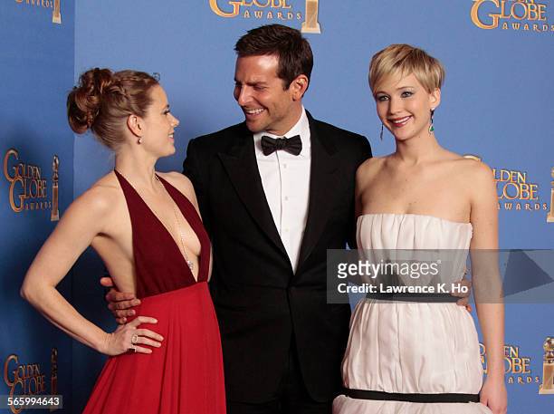 January 12, 2014 Amy Adams, Bradley Cooper, and Jennifer Lawrence in the deadline room winning for Best Motion Picture - Musical or Comedy for...