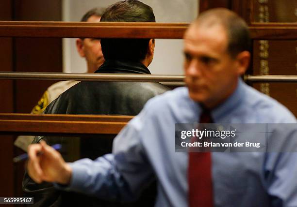 Scott Schenter, a former appraiser with the Los Angeles County Assessor's Office, stands with his back to the courtroom as he appears for arraignment...