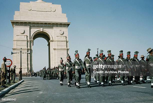 Military parade past India Gate on the Rajpath in Delhi, India, possibly the Delhi Republic Day parade, circa 1965.