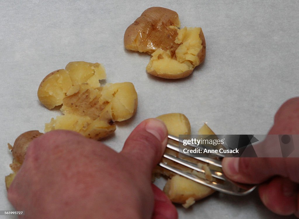 Step two smash gently with fork for Step By Step of smashed fries for food shoot in Los Angeles Tim