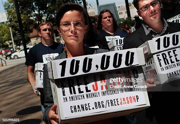 Sarah Shourd , front left, an American hiker detained in Iran from 20092011, Jon Perri, right, from change.org, and other activists tried to deliver...