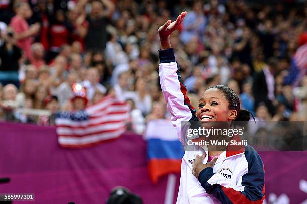 S Gabrielle Douglas waves to the crowd after winning the gold medal in the women's individual allaround at the 2012 London Olympics on Thursday.