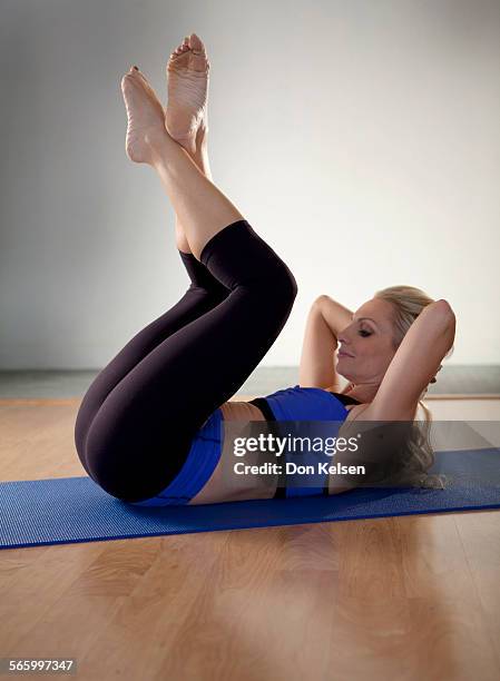   Tracey Mallett demonstrates the Frog pelvic tilt .PHOTOGRAPHED TUESDAY FEBRUARY 28, 2012.