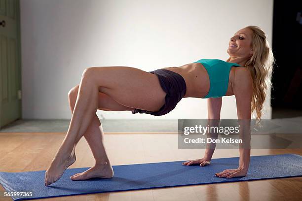   Tracey Mallett demonstrates the Tricep kicks .PHOTOGRAPHED TUESDAY FEBRUARY 28, 2012.