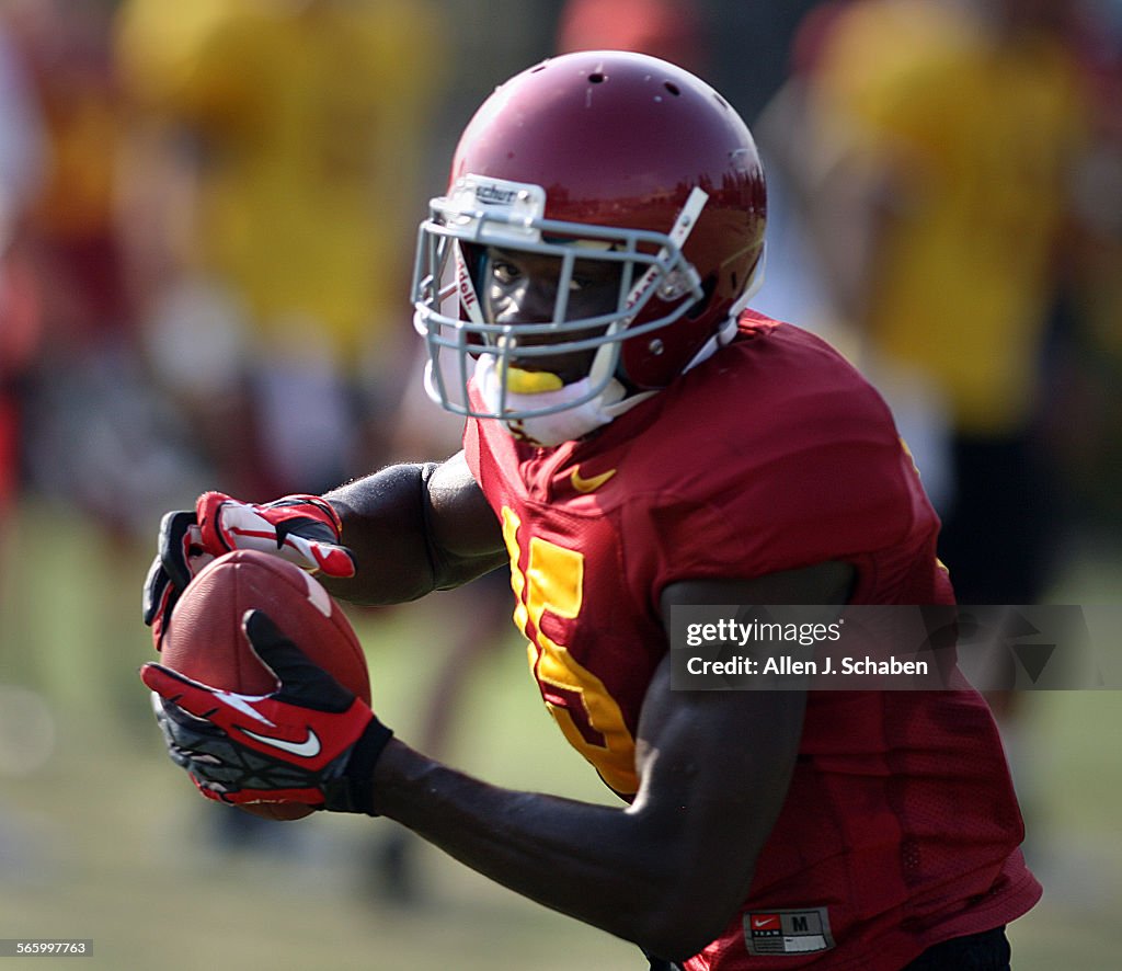 USC wide receiver/tail back Nelson Agholor runs with the ball during practice at USC Friday, Aug. 1