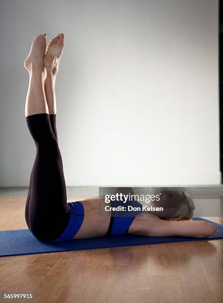   Tracey Mallett demonstrates the Frog pelvic tilt .PHOTOGRAPHED TUESDAY FEBRUARY 28, 2012.