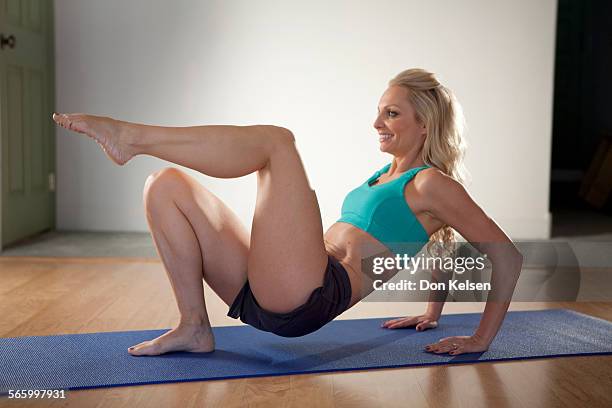   Tracey Mallett demonstrates the Tricep kicks .PHOTOGRAPHED TUESDAY FEBRUARY 28, 2012.