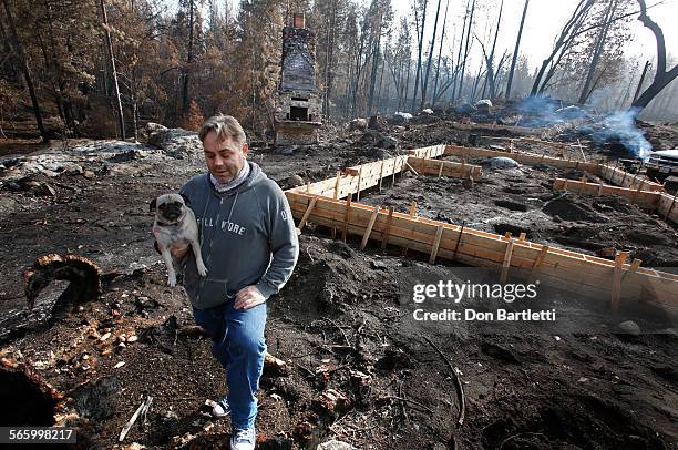 Dharma Barsotti stands in the center of what used to be the base of a 1000-year-old black oak tree that towered over his family's old home on...