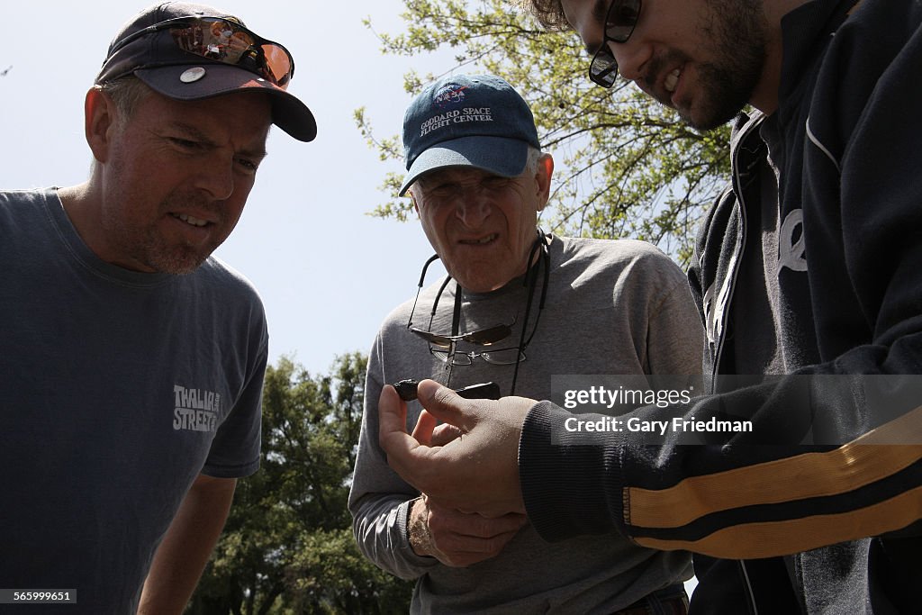 Jason Utas, (right) a 21 year of geology student at UC Berkeley, shows a 7.5 grams fragment of a me