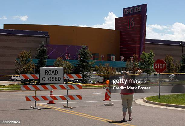 Police tape and barricades still encircle the parking lot at the Century 16 Theaters July 22, 2012 in Aurora, Colorado where 12 people were killed...