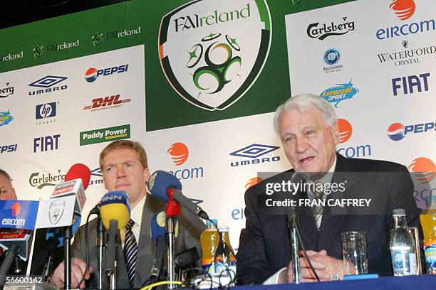 Football Association of Ireland new International Soccer Team Manager Steve Staunton talks with his assistant Sir Bobby Charlton speaking at a press...