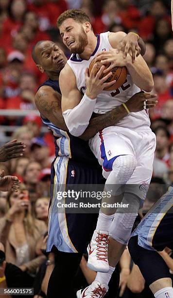 Clippers forward Blake Griffin is corraled by Grizzlies forward Marreese Speights during the second half in game six of the NBA Western Conference...