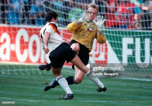 Goalkeeper Jan Stejskal of Czechoslovakia and Uwe Bein of Germany battle for the ball during the World Cup quarter final match between Germany and...
