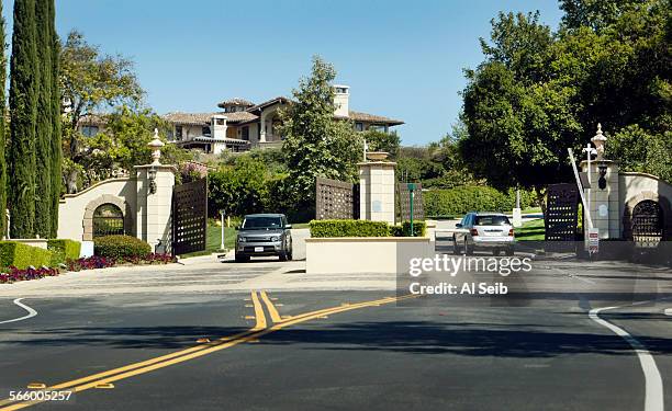 The second of two gates on Parkway Calabasas in the The Oaks, a guard gated luxury community in Calabasas on May 30, 2013 guards the home and...