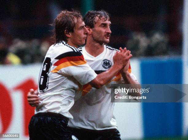 Juergen Klinsmann and Rudi Voeller of Germany celebrates scoring the first goal during the World Cup group D match between Germany and United Arab...