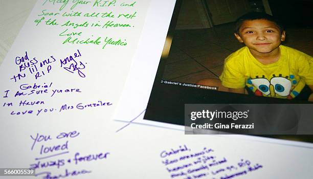 Tributes are written on a poster board during a memorial service for Gabriel Fernandez a Palmdale boy who was allegedly beat to death by his mother's...