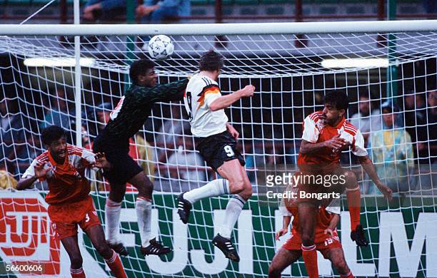 Rudi Voeller of Germany scores the fifth goal for Germany during the World Cup group D match between Germany and United Arab Emirates at the Guiseppe...
