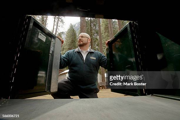 Dan Cornforth, General Manager of Camp Curry in Yosemite is framed by the doors of a bear locker that was improved and slightly modified to insure...