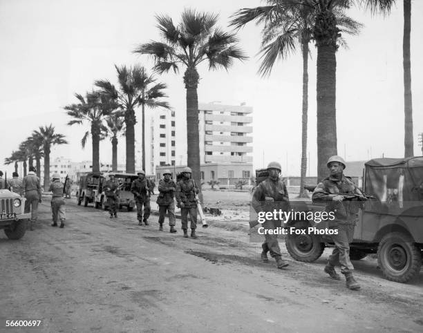 British troops patrolling a street in Port Said, Egypt during the Suez Crisis, 12th November 1956.