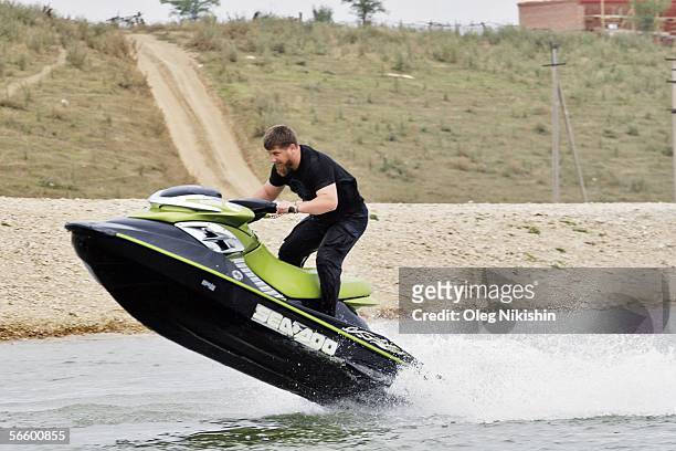 Chechen First Deputy Prime Minister Ramzan Kadyrov demonstrates his driving skills on his jet ski on a lake near the village of Centoroy, Chechnya, 3...