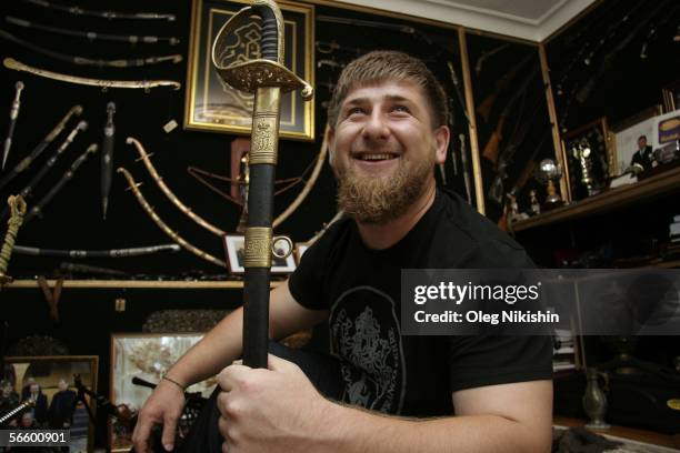 Chechen First Deputy Prime Minister Ramzan Kadyrov shows his extensive collection of weapons in his office in Gudermes, 2 August 2005, Chechnya,...