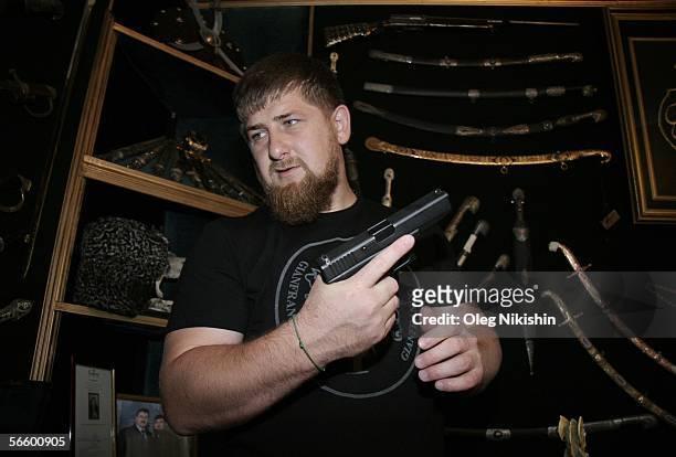 Chechen First Deputy Prime Minister Ramzan Kadyrov shows his extensive collection of weapons in his office in Gudermes, 2 August 2005, Chechnya,...