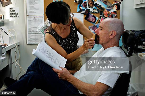 Actor Bryan Cranston, who plays Walter White, has his goatee brushed by makeup artist Frieda Valenzuela before a day of shooting on AMC's "Breaking...