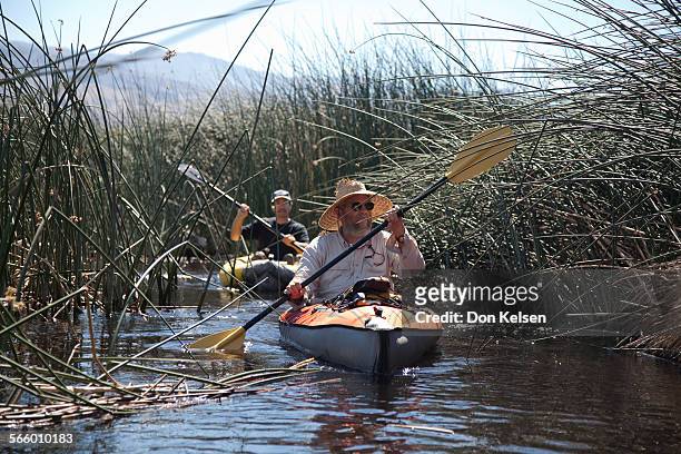  Mike Prather, long time Owen's Valley environmental activist and Larry Freilich , Inyo County Midigation Projects manager navigate, by kayak, the...