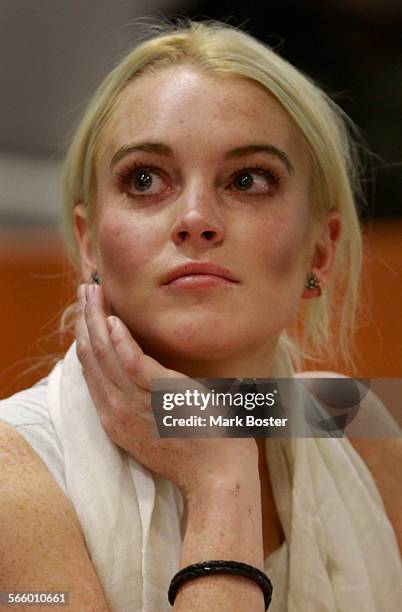 Actress Lindsay Lohan listens to the judge during her probation status hearing in Los Angeles Superior Court October 19, 2011. Judge Stephanie...