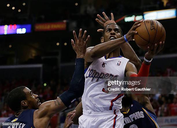 Clippers guard Chris Paul shoots over Grizzlies defenders Mike Conley, left, and Tony Allen during second half action in game five of the of the NBA...